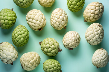 Top view of whole Custard Apple fruits on blue background