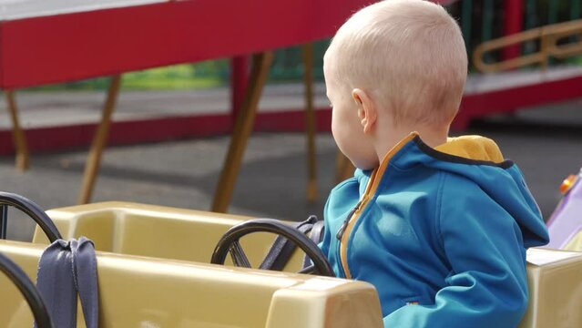 toddler child in amusement park Divo Ostrov, St. Petersburg, Russia