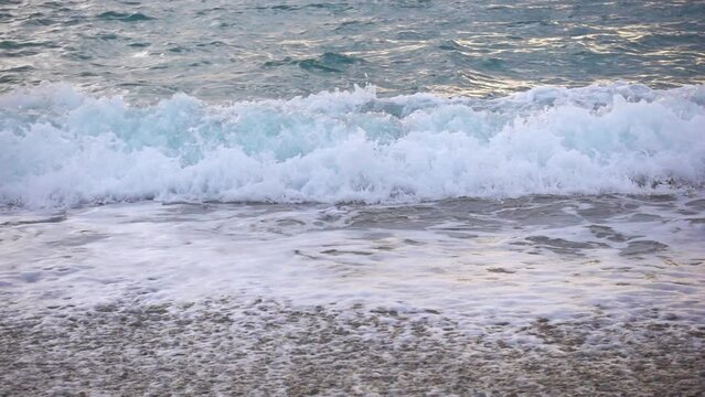 Close Up Shot of Ocean Waves in Slow Motion Over a Pebbled Beach in Looc Bay, Philippines