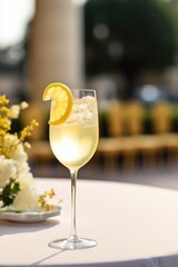 A glass of cocktail French 75 on blurry luxury background.