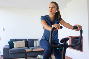 Woman on Stationary Bike Working Out at Home