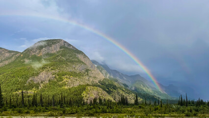 Rainbow over mountain in Jasper National Park in Canada.