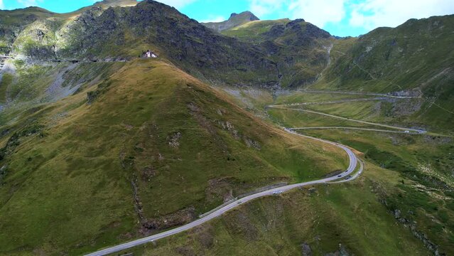 Switchbacks wind up mountain pass Transfagarasan Serpentine Road romania, aerial perspective