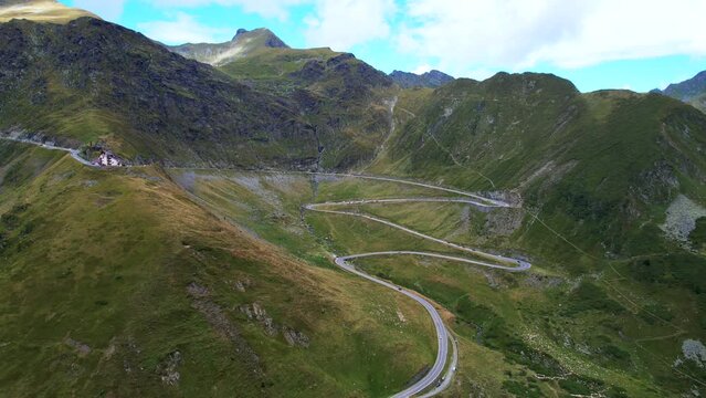 Aerial pullback panoramic view of Transfagarasan Serpentine Road switchbacks