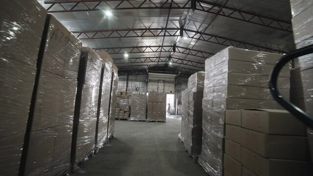Production warehouse. Storage of finished products in boxes and plastic packages. Hangar, product distribution, sales