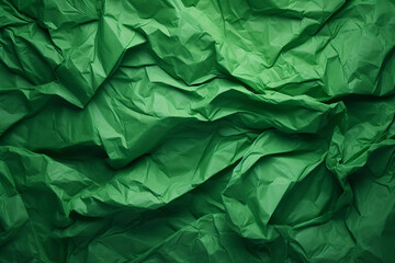 Crumpled green paper texture. Green background 