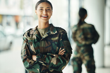 Portrait, soldier and woman with arms crossed, military and security with a smile, confident and power. Face, person and warrior with pride, camouflage and protection with training, happy and war