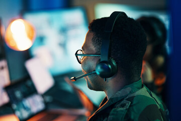 Military control room, computer and man and surveillance from back, tech and communication at desk. Security, global and soldier in army office at government cyber intelligence command center.