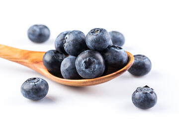 Fresh blueberries in wooden spoon