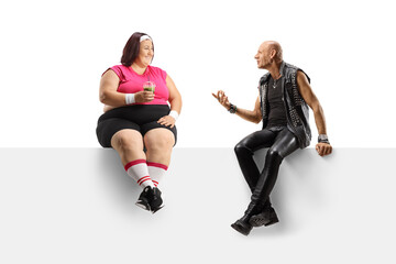 Punk talking to a young corpulent in sportswear lady and sitting on a panel