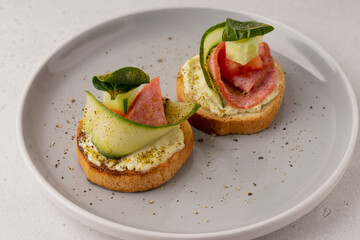 tomato and cucumber sandwiches on a plate