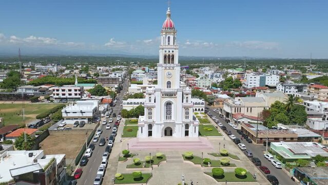Facade of Sacred Heart of Jesus Church or Iglesia Sagrado Coraz&oacute;n De Jesus, Moca in Dominican Republic. Aerial approach