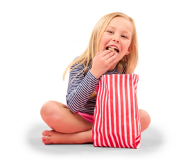 Girl kid is eating popcorn, happy with food or cinema snack, movie and relax with paper bag isolated on png transparent background. Youth, entertainment and corn, hungry and streaming with smile