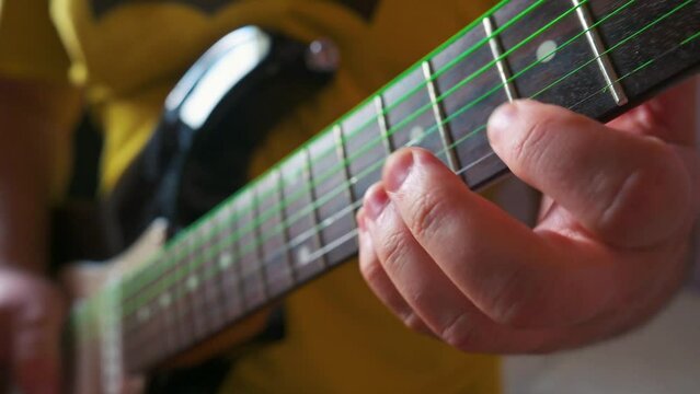 Man playing electric guitar. 4k video footage UHD 3840x2160