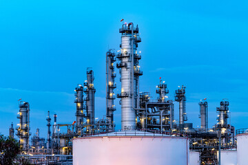 Oil and gas refinery plant firm industry zone at night.Oil and gas Industrial petrochemical fuel power and energy.Chemical Industry.Gas storage tanks and oil storage tank in refinery industrial plant.