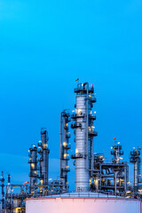 Oil and gas refinery plant firm industry zone at night.Oil and gas Industrial petrochemical fuel power and energy.Chemical Industry.Gas storage tanks and oil storage tank in refinery industrial plant.