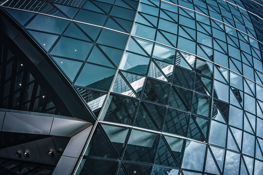 London, UK - 25 March 2022:  Detail of 30 St Mary Axe, known as The Gherkin or Swiss Re building. City of London.