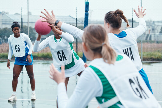 Netball sports team, game ball and women defend, attack and pass in community competition, practice and game. Exercise, group action and player workout, tournament match or athlete training on court