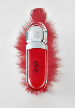 Kiko Milano red lipstick on red feather . Riga, Latvia - August  16, 2022: 