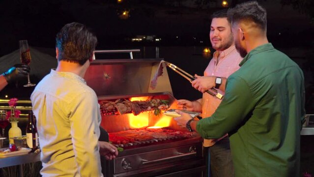 Friends latin mexican at barbecue night party garden grill fire steak raw meat sausage waiters champagne glasses wine cocktail drinks enjoy meeting happy smile
