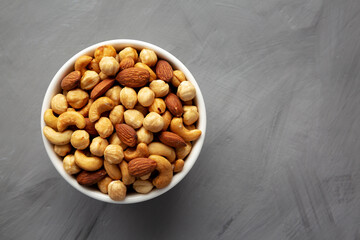 Roasted Assorted Nut Mix with Cashews, Almonds and Hazelnuts in a Bowl, top view. Flat lay, overhead, from above. Copy space.