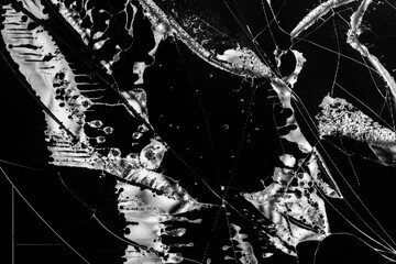 cracks on the broken screen of a liquid crystal display, computer monitor or television black and white photo