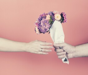 Hands, bouquet of flowers, gift.