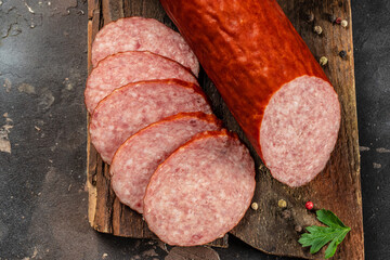 Sausage Salami with spices on a wooden board. organic healthy products. place for text, top view