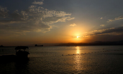 Sunset on the beach of the city of Aqaba, located in the Gulf of Aqaba on the Red Sea