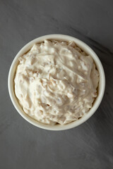 Homemade French Onion Dip in a Bowl on a gray background, top view.