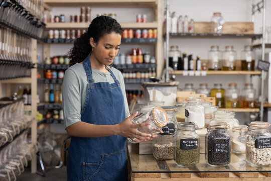 Sales assistant working in a zero waste store