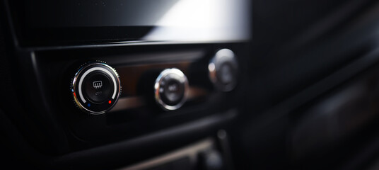 The process of choosing climate control in the car. Various controls in auto switches. Modern car interior