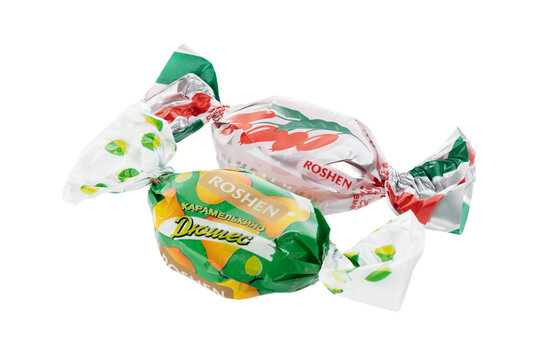 Dnipro, Ukraine - 08.25.2023: Barberry and Duchess caramel sweets from Roshen. Lollipops in packaging.