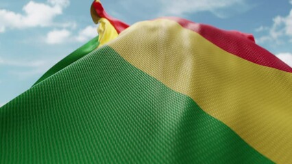 Wavy flag Republic Of The Congo blowing in the wind in slow motion. Waving official Congolese flag team symbol abstract vertical background. Blue sky with clouds. World countries flying flags concept