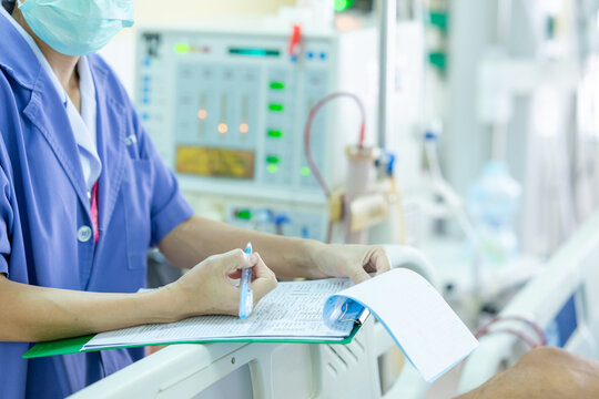 The specialist are checking continuous renal replacement therapy equipment and injection pump and hemodialysis machine.