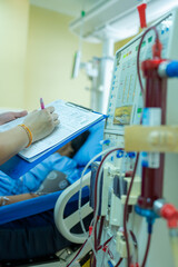 The specialist are checking continuous renal replacement therapy equipment and injection pump and...