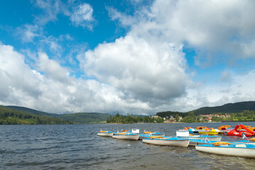 Fototapeta na wymiar Colorful boats in the harbour of the lake named 