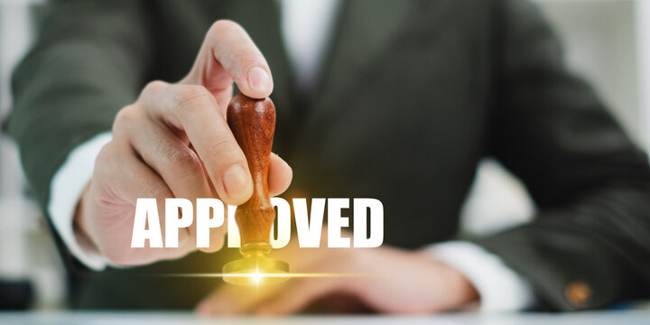 ็Hand's of businessman, notary or lawyer stamp to approved business authority, signature, agreement paper document contract. Certified, successful, project approval, guarantee form, quality concept.