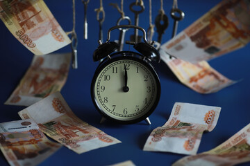 Retro keys on ropes in hand. Flying banknotes. Concept of business ideas.