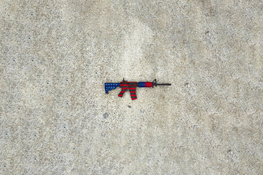 M4A4 weapon in the colors of the american flag. Veterans day concept.