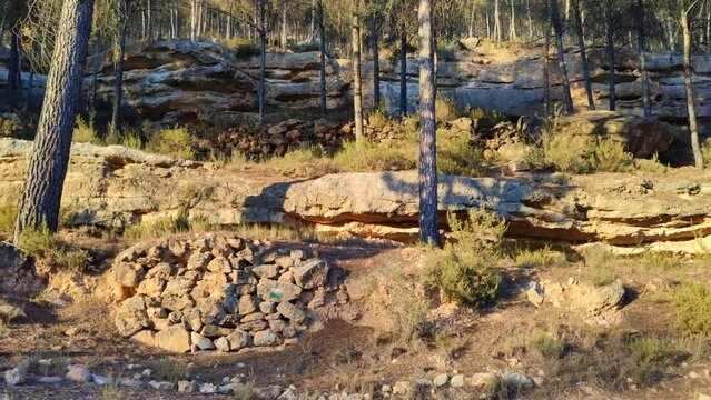 View of roads, nature, geological formations and walls of rural architecture on the mountain of La Muela in Rincón de Ademuz, near the archaeological site of La Celadilla on the Iberian Peninsula