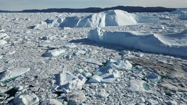 Greenland Ilulissat Icefjord Aerial View. Iceberg and glacier ice in Arctic nature landscape in Greenland. Ilulissat, Disko Bay, Baffin Sea, Greenland.