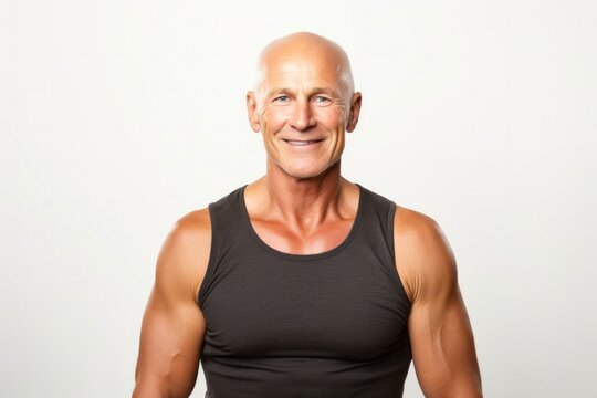 portrait of a confident Polish man in his 50s wearing a sporty tank top against a white background