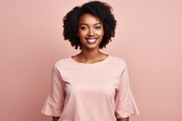 medium shot portrait of a confident Kenyan woman in her 20s wearing a simple tunic against a pastel or soft colors background