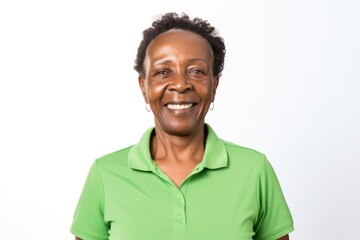 medium shot portrait of a confident Kenyan woman in her 60s wearing a sporty polo shirt against a white background
