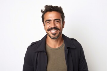 Obraz premium medium shot portrait of a confident Mexican man in his 30s wearing a chic cardigan against a white background