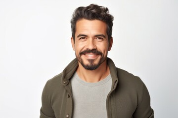 Obraz premium medium shot portrait of a confident Mexican man in his 30s wearing a chic cardigan against a white background