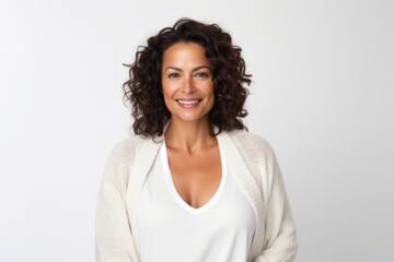 medium shot portrait of a confident Mexican woman in her 40s wearing a chic cardigan against a white background