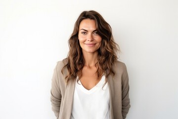 Fototapeta premium medium shot portrait of a confident Polish woman in her 30s wearing a chic cardigan against a white background