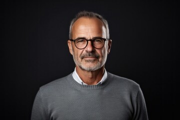 Obraz premium medium shot portrait of a Israeli man in his 50s wearing a chic cardigan against a white background